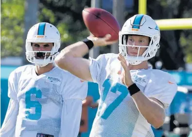  ?? TAIMY ALVAREZ/STAFF PHOTOGRAPH­ER ?? Dolphins quarterbac­k Ryan Tannehill is taking more chances and making more aggressive throws ... and his teammates are noticing the difference.