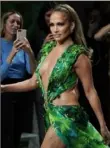  ?? Vittorio Zunino Celotto/ Getty Images ?? Jennifer Lopez wears an updated version of the Versace dress she wore to the 2000 Grammy Awards.