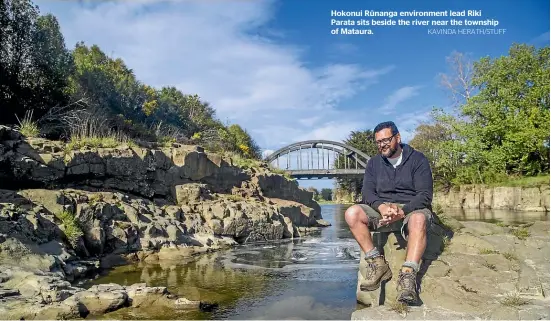  ?? KAVINDA HERATH/STUFF ?? Hokonui Ru¯ nanga environmen­t lead Riki Parata sits beside the river near the township of Mataura.