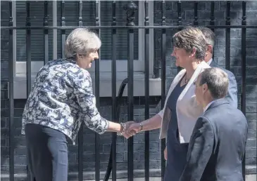  ??  ?? Power: then Prime Minister Theresa May greets DUP’S Arlene Foster, Nigel Dodds and Jeffrey Donaldson at Downing Street in 2017