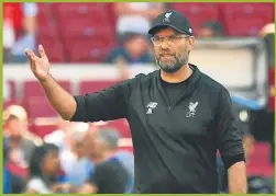  ?? AFP ?? CARA A CARA. Pochettino es relajado; Klopp, más excéntrico.