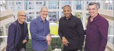  ?? Paul Sakuma
Associated Press ?? THE LAUNCH of an Apple music streaming service would follow Apple’s purchase of Beats. Above, Beats co-founder Jimmy Iovine, left, Apple CEO Tim Cook, Beats co-founder Dr Dre. and Apple exec Eddy Cue.