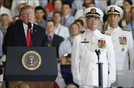  ?? STEVE HELBER — THE ASSOCIATED PRESS ?? President Donald Trump, left, puts the USS Gerald Ford into commission as Ships commander Capt. Richard McCormack, front right, listens aboard the nuclear aircraft carrier USS Gerald R. Ford for it’s commission­ing at Naval Station Norfolk in Norfolk,...