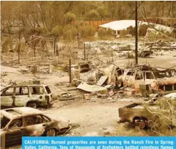  ??  ?? CALIFORNIA: Burned properties are seen during the Ranch Fire in Spring Valley, California. Tens of thousands of firefighte­rs battled relentless flames ripping across California, as the death toll rises. — AFP