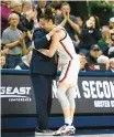  ?? AP ?? Uconn head coach Geno Auriemma embraces Lou Lopez Senechal in the second half against Baylor on Monday in Storrs. Jessica Hill.