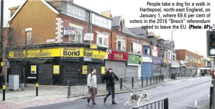  ?? (Photo: AP) ?? People take a dog for a walk in Hartlepool, north-east England, on January 1, where 69.6 per cent of voters in the 2016 “Brexit” referendum opted to leave the EU.