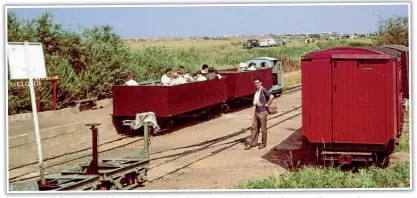  ??  ?? It’s a sunny June day in 1961 and the LCLR has been open for less than a year but is developing rapidly. A train of two open carriages converted from First World War Class D bogie wagons is ready to depart for Beach station behind the line’s first locomotive, Motor-Rail Simplex No. 3995 of 1926 Paul. On the right are former First World War ambulance vans that once carried potatoes on Lincolnshi­re’s Nocton Estates Railway, while spare bogies can be seen on the left. GORDON GREEN