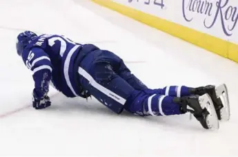  ?? RICHARD LAUTENS/TORONTO STAR ?? Leaf James van Riemsdyk gets up slowly after a hit, before leaving Monday’s game against the Kings.