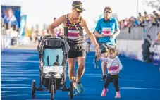  ??  ?? Jason Hyland and daughter Zari Hyland in the 5.7km.