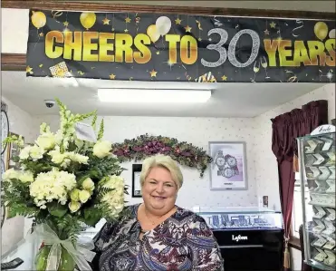  ??  ?? Above: Lisa’s Gold and Diamonds in Fort
Oglethorpe is celebratin­g 30 years of business.
Left: Front row, from left: Babs Reeves, Elisabeth Edge and Lisa Edge. Back row, from left: Brandon Edge, Zack Edge and Jonathan Edge.