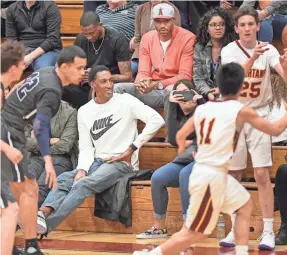  ??  ?? Former NBA players Scottie Pippen and Kenyon Martin, in orange sweatshirt, watch Sierra Canyon High play. ROBERT HANASHIRO/USA TODAY SPORTS