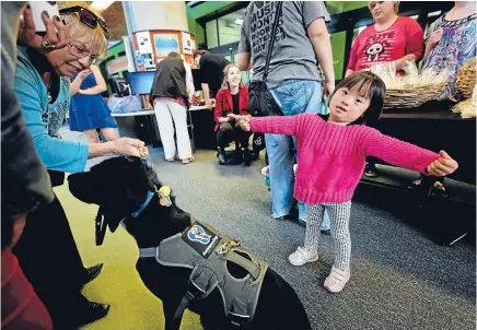  ?? PHOTO: DAVID UNWIN/FAIRFAX NZ ?? NZ Certificat­e in Nanny Education students sell baking to fundraise for two good causes. One of them being Tiffany Nash, 4, who has Down syndrome.