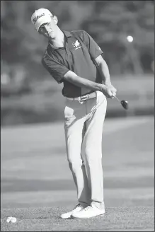  ?? NWA Democrat-Gazette File Photo/DAVID GOTTSCHALK ?? Rogers High golfer Andrew Fakult practices chipping Sept. 16 before play at Lost Springs Golf and Athletic Club in Rogers. Fakult should be among the favorites to win the upcoming Class 6A state golf tournament.