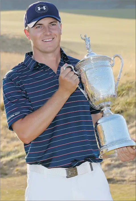  ?? — THE ASSOCIATED PRESS ?? Jordan Spieth holds the trophy after winning the U.S. Open golf tournament at Chambers Bay on Sunday in University Place, Wash. It was the second major of the year for the 21-year-old.