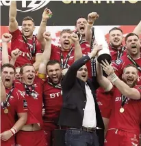  ??  ?? Winners: Scarlets celebrate their PRO12 success