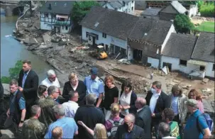  ?? CHRISTOF STACHE / AFP ?? German Chancellor Angela Merkel visits flood-ravaged areas in Schuld, near Bad Neuenahr-Ahrweiler, western Germany, on Sunday.