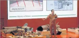  ?? REUTERS ?? ■ A Saudi defence ministry spokesman displays remains of the missiles used in the oil plant attack.