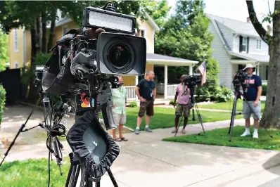  ?? AP Photo/jacquelyn Martin, File ?? ■ Television crews film near the home of Supreme Court Justice Brett Kavanaugh on Wednesday in Chevy Chase, Md. Officials say an armed man who threatened to kill Justice Kavanaugh was arrested near the justice’s house. One proposal pending in Congress would provide additional security measures for the justices and another would offer more privacy and protection for all federal judges.