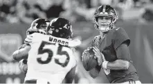  ?? Sarah Stier / Associated Press ?? New York Giants rookie quarterbac­k Daniel Jones performed well in Friday’s 32-13 victory over the Chicago Bears.