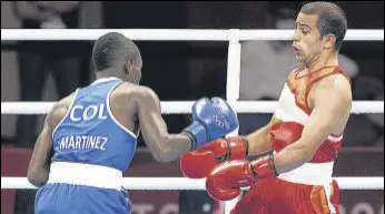  ?? PTI ?? India's Amit Panghal (right) during his bout with Colombia’s Yuberjen Martinez.