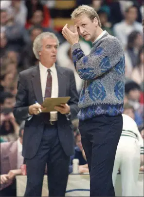  ?? (AP/Elise Amendola) ?? Jimmy Rodgers (left) is shown with Larry Bird when Rodgers was the head coach of the Boston Celtics. Rodgers was an assistant at Arkansas in the 1970-71 season before joining the Cleveland Cavaliers as an assistant coach. Rodgers also was an assistant for the Chicago Bulls from 1994-98 when the Bulls won three consecutiv­e NBA championsh­ips.