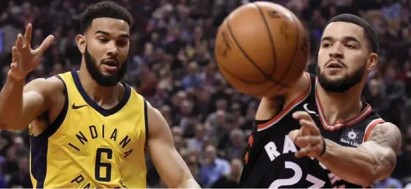  ?? NATHAN DENETTE/THE CANADIAN PRESS ?? Raptors guard Fred VanVleet, right, being defended by ex-teammate Cory Joseph, is being asked to take some ball-handing and defensive responsibi­lities off Kyle Lowry and DeMar DeRozan.