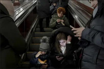  ?? EMILE DUCKE — THE NEW YORK TIMES ?? Civilians shelter in a subway station as an air- raid siren sounds in Kyiv, Ukraine, on Friday. Russia targeted Ukraine’s battered infrastruc­ture with drones, rockets and cruise missiles overnight Friday into Saturday, raining fire on cities around the country one day after President Volodymyr Zelensky wrapped up a two- day push in Europe for more, faster support from Kyiv’s allies.