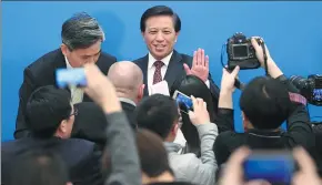  ?? FENG YONGBIN / CHINA DAILY ?? Zhang Yesui, spokesman for the first session of the 13th National People’s Congress, takes his leave from journalist­s after answering questions in the conference room at the Great Hall of the People in Beijing on Sunday.