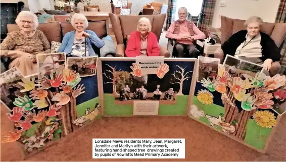  ?? ?? Lonsdale Mews residents Mary, Jean, Margaret, Jennifer and Marilyn with their artwork, featuring hand-shaped tree drawings created by pupils of Rowlatts Mead Primary Academy