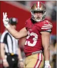  ?? THEARON W. HENDERSON — GETTY IMAGES ?? The Niners' Christian McCaffrey gestures after scoring his fourth TD Sunday, one short of a team record for a game. His coach didn't notice.