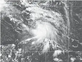  ?? AP ?? This Sept. 12 image provided by NOAA shows the formation of Tropical Storm Sally. The storm dumped historic amounts of rain on the northern Gulf Coast, killing at least one person.