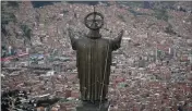  ?? NATACHA PISARENKO — THE ASSOCIATED PRESS ?? A Christ statue overlooks El Alto, a city adjoining the capital city La Paz, Bolivia.