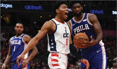  ?? File photo ?? Joel Embiid, right, and the Philadelph­ia 76ers are one of the teams, along with the Boston Celtics, chasing the No. 1 Milwaukee Bucks in the Eastern Conference. Currently, battling Indiana for the No. 5 seed.