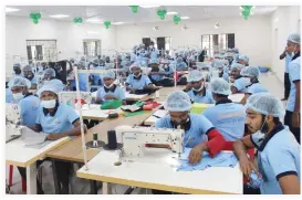  ??  ?? Inmates at work in the recently launched Narayangon­j Garment factory, the first of its kind in Bangladesh. (AN photo)