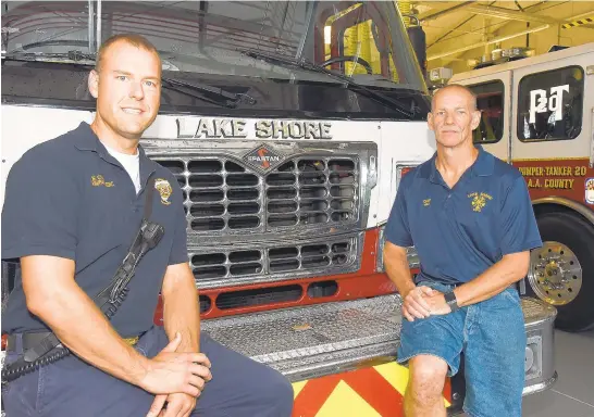  ?? PHOTOS BY PAULW. GILLESPIE/CAPITAL GAZETTE ?? Anne Arundel County Fire Department Capt. Joe Cvach, left, and Lake Shore Volunteer Fire Company Chief Timothy Hall stand in the new Lake Shore fire station in Pasadena.
