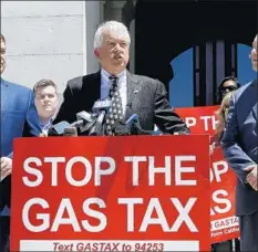  ?? Rich Pedroncell­i Associated Press ?? GOP gubernator­ial candidate John Cox blasts the gas tax increase at a recent news conference. He sees repeal as a winning issue for voters.