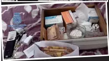  ??  ?? Seized: Large amounts of pills and cash were found by police during the police raid