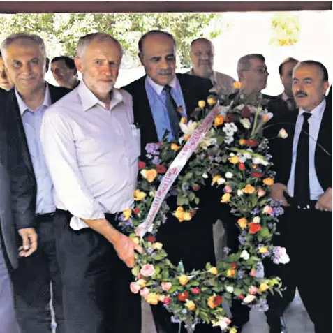  ??  ?? Jeremy Corbyn, pictured in 2014, holding a wreath at a cemetery in Tunis, close to the graves of those responsibl­e for the massacre of Israeli Olympic athletes in 1972