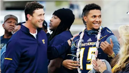  ?? STAFF FILE PHOTO BY DOUG STRICKLAND ?? UTC football coach Tom Arth, left, greets Alejandro Bennifield as graduating seniors are honored before the Mocs’ final home game of the season against ETSU at Finley Stadium on Nov. 18.