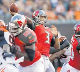  ?? GARY LANDERS/ASSOCIATED PRESS ?? Tampa Bay Buccaneers quarterbac­k Jameis Winston fires a pass downfield during the first half of the team’s preseason loss against the Bengals on Friday night in Cincinnati.