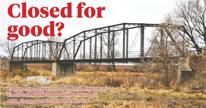  ?? [STEVE KANNON / THE OBSERVER] ?? An engineerin­g report recommends the permanent closure of the Peel Street bridge in Winterbour­ne. The fate of three old steel spans in the township will be decided by Woolwich council following the review period.