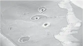  ??  ?? Strange ice circles were seen in Arctic sea ice on April 14. “I have never seen anything like that before,” NASA scientist Nathan Kurtz said. NASA ICE BRIDGE