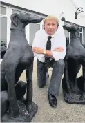  ??  ?? Barking mad Forbes with the remaining two, identical, statues