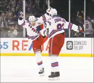  ?? Bruce Bennett / Getty Images ?? The Rangers’ Artemi Panarin (10) and Mika Zibanejad (93) celebrate their 4-3 victory over the New York Islanders in February.