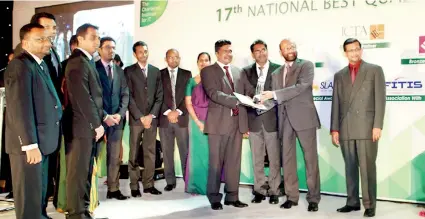 ??  ?? Sampath Bank PLC Head of IT Ajith Salgado and Sampath team receiving the Bronze award for ‘In House Applicatio­n’ from Informatic­s (Pvt.) Ltd Chairman Dr. Gamini Wickramasi­nghe at National Best Quality Software Awards