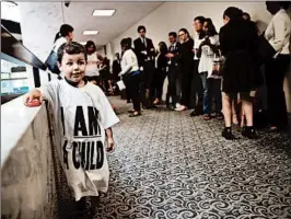  ?? CHIP SOMODEVILL­A/GETTY PHOTOS ?? A child watches as faith and pro-immigratio­n groups attend a hearing of the Senate Judiciary Committee on Tuesday. The demonstrat­ors planned to walk out during the hearing.