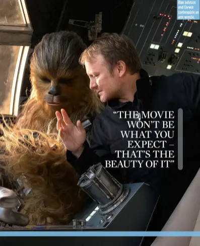  ??  ?? Rian Johnson and Chewie contemplat­e an arm wrestle.