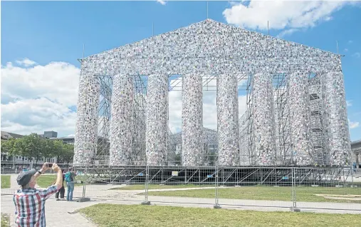  ??  ?? The Parthenon Of Books by Argentinia­n artist Marta Minujin, which is under constructi­on, in preparatio­n for the upcoming documenta 14 in Kassel, Germany.