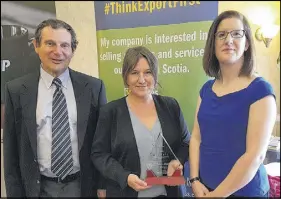  ??  ?? Exporter of the Year – Pure Paint David Copus of award sponsor NSBI, Gena Arthur of Pure Paint in Bible Hill and chamber president Joanne Mcrae.