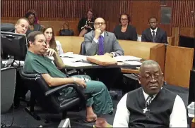  ?? MACOMB DAILY FILE PHOTO ?? Bob Bashara sits in court Monday with his attorney, Mark Procida, left, and Rene Cooper, right, during his preliminar­y examinatio­n in the slaying of his wife, Mount Clemens native Jane, 56, in the garage of their Grosse Pointe Park home.